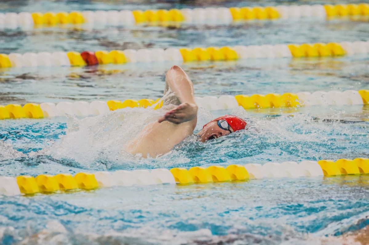 Lane lines stretched across a swimming pool surface