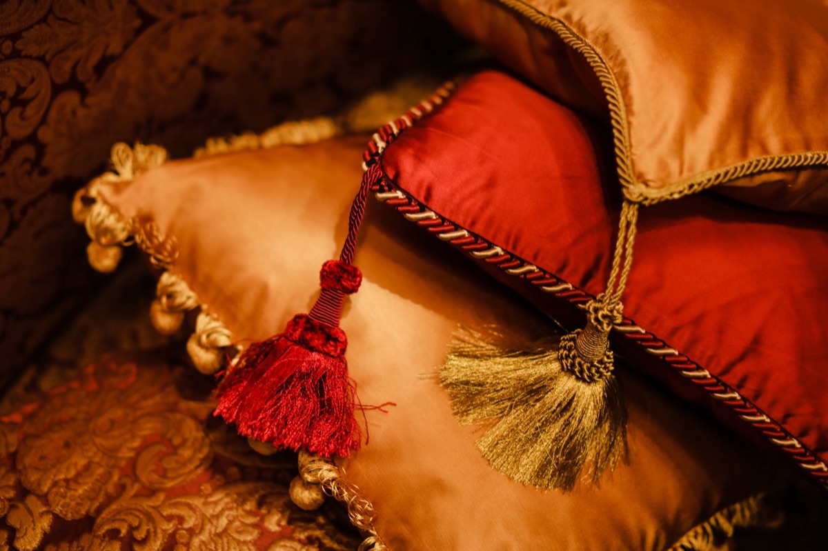 Gold medal displayed on a dark presentation cushion