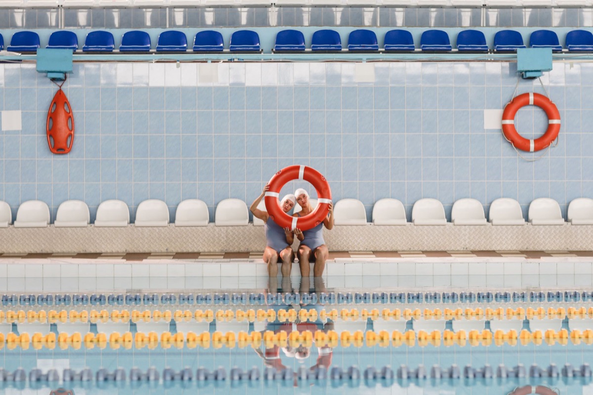 Beginner using float and lifeguard gear in pool